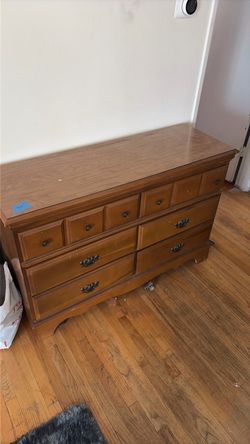 Solid wood dresser w/ mounted mirror.