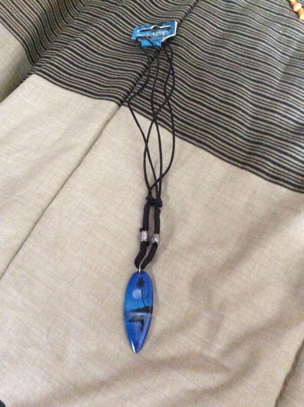 Necklace with surfboard on paints new