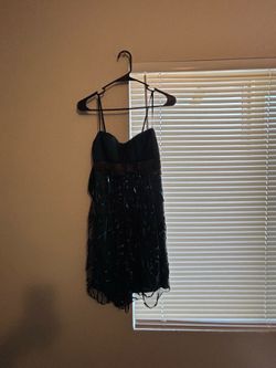 Black mini dress with ruffle floral pattern embellishments
