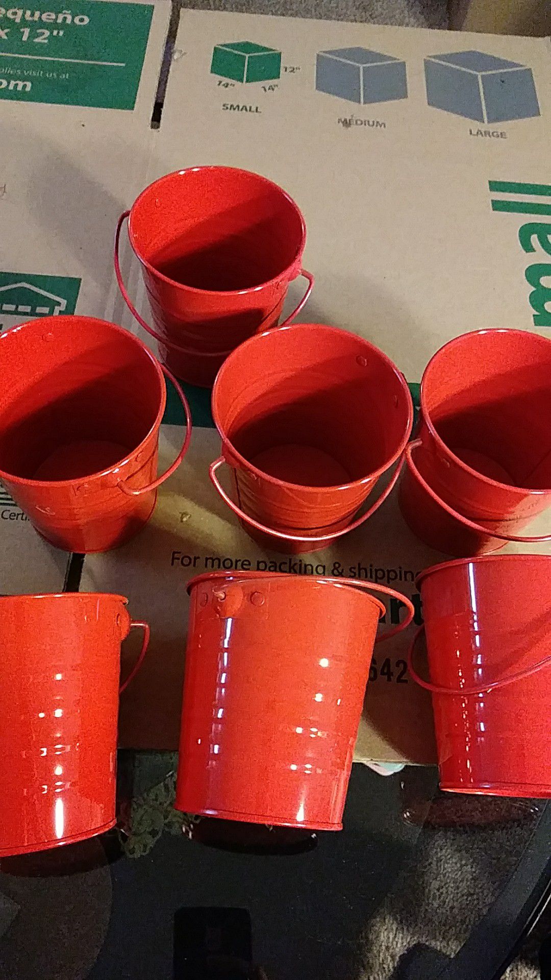 7 small red buckets