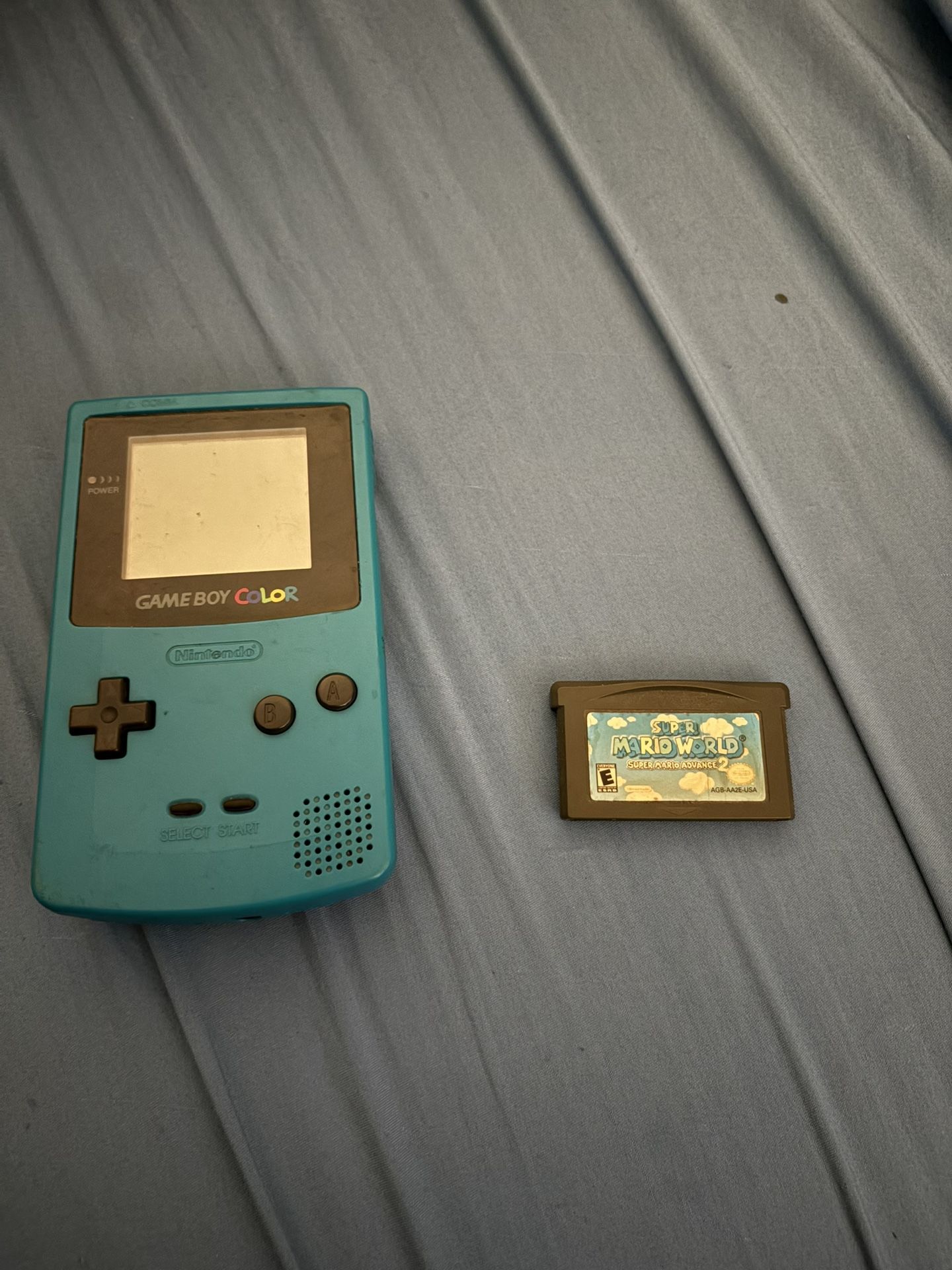 Blue/Cyan Gameboy Color And Super Mario World Advance 2