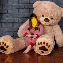 Selling a stuffed teddy bear.