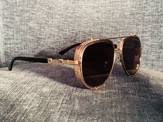 Gold-rimmed sunglasses
