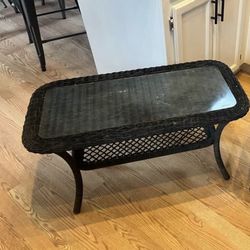 Dark wicker glass top table