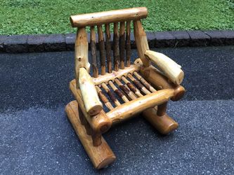 Super cute child’s log rocking chair