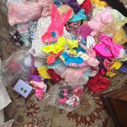 Barbie doll clothes and some shoes
