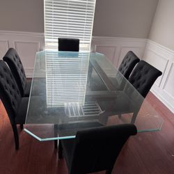 Glass dining room table with chairs