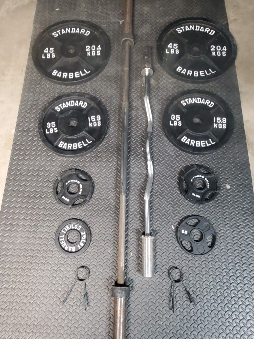 Olympic Weight Set With Olympic Bar & Curl bar..210lbs all together read Description below...