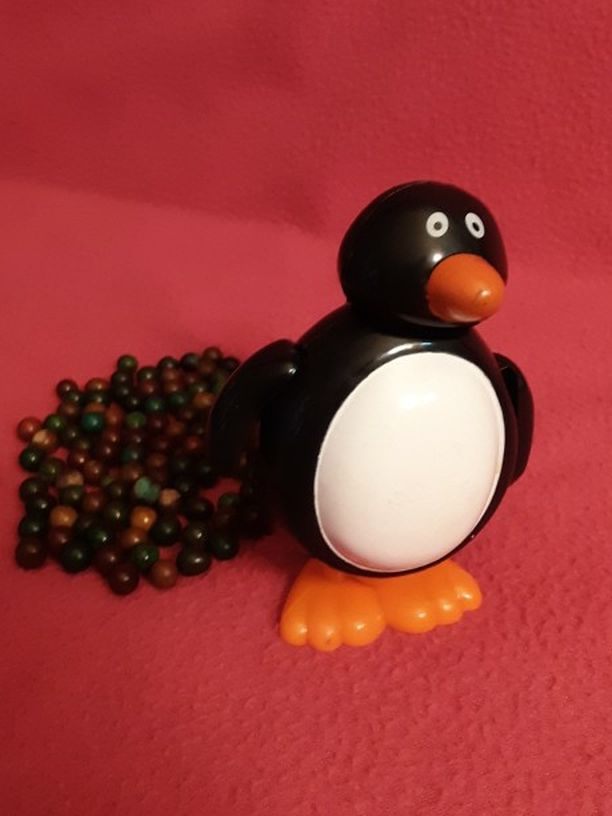 The Amazing Walking Penguin Pooper Wind Up Toy