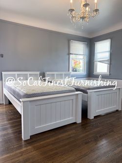 White twin bed and mattress