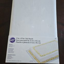 Wilton 6-Count White Corrugated Rectangular Cake Board set, measuring 13 by 19 inches