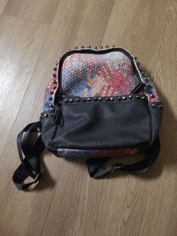 Studded Woven Patchwork Backpack first person 5$off