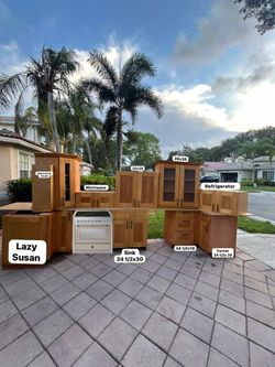 Wood kitchen cabinets with light inside upper