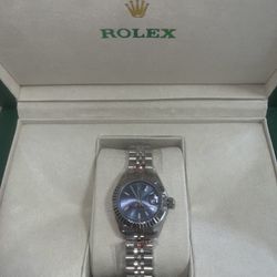 Rolex (Comes with papers)
