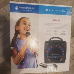 SINGING MACHINE SML-283 PORTABLE CD-G KARAOKE PLAYER AND 3 CDGS PARTY PACK - BLACK 220 VOLTS