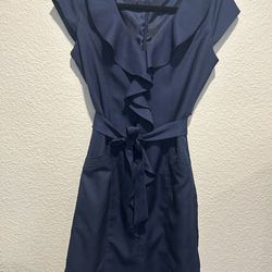 This is a stylish, navy blue Sharagano dress, perfect for a professional or semi-formal setting.