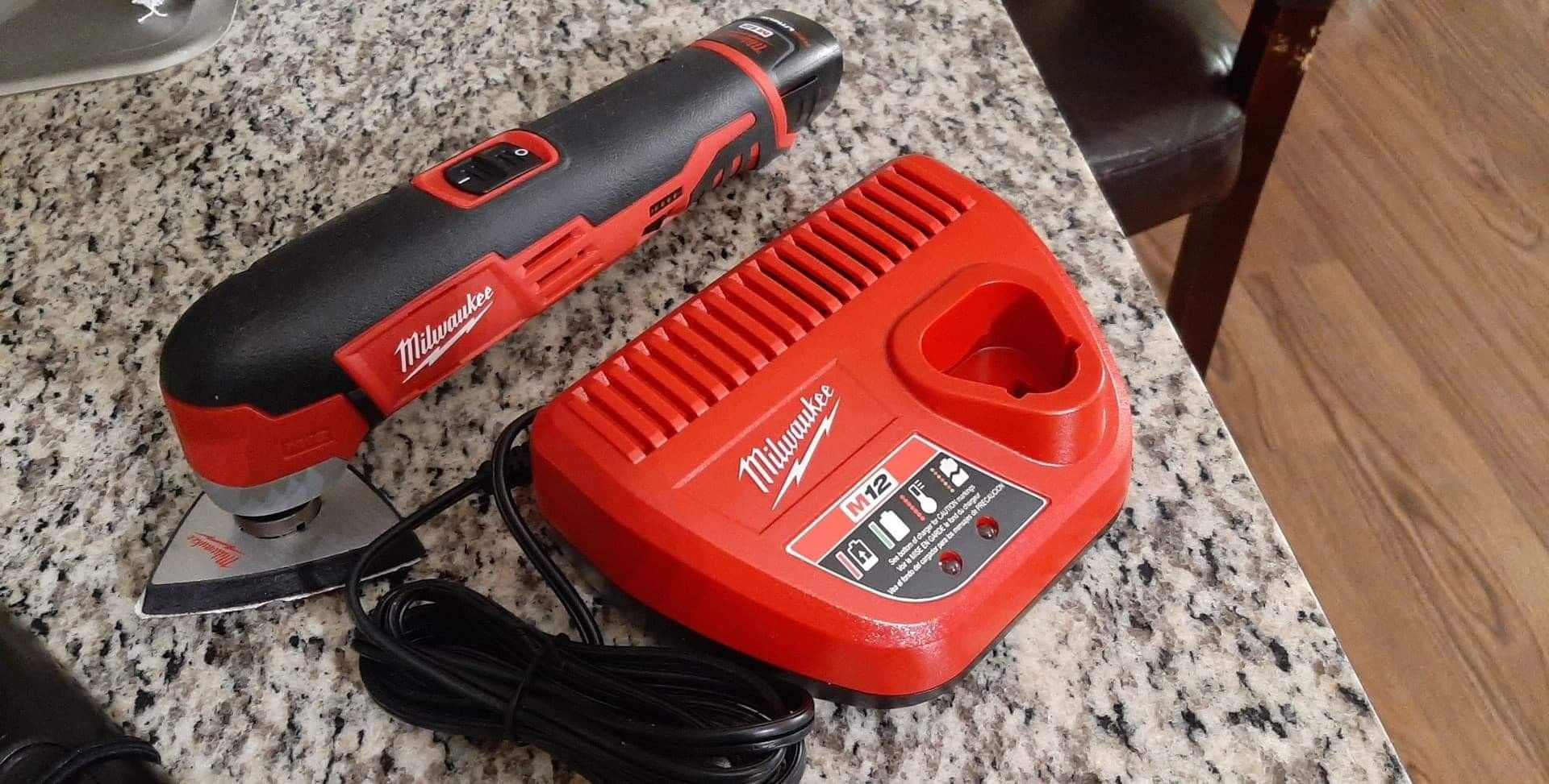 Milwaukee Multi-tool 2426-20 with 2.0 battery and charger