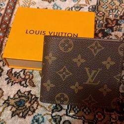 (Brown) Louis Vuitton wallet.