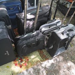 LOTS OF NICE PULL ALONG LUGGAGE 