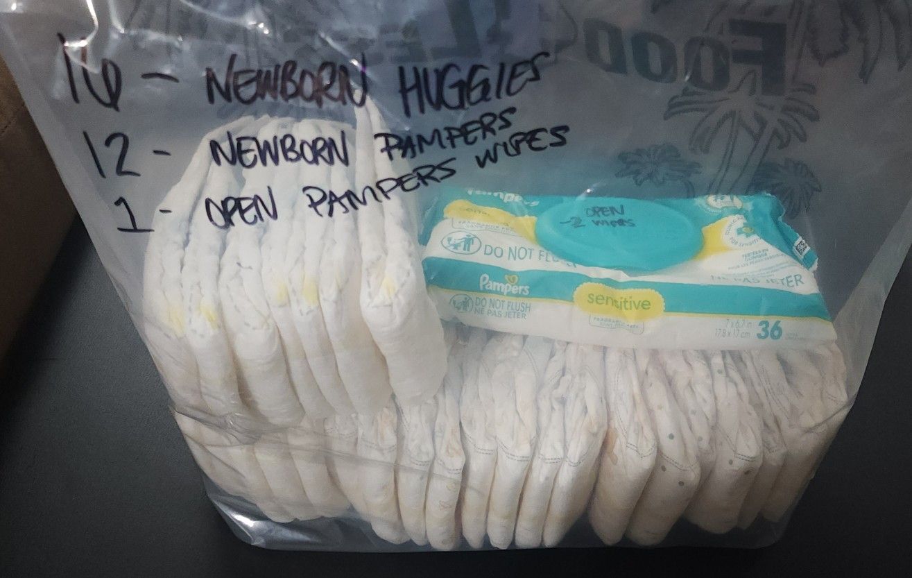 28 Newborn Diapers - Huggies/Pampers