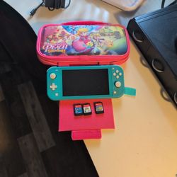 Nitendo Switch Lite With 3 Games And 2 Games Download. With Charger And Case