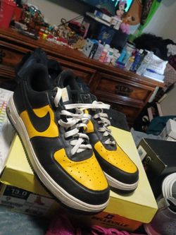 Black and yellow Air Force ones