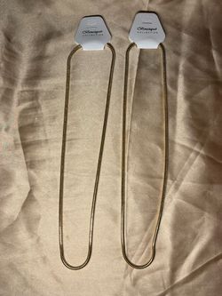 Boutique Collection gold-tone snake chain necklace featuring a smooth, flexible tubular design
