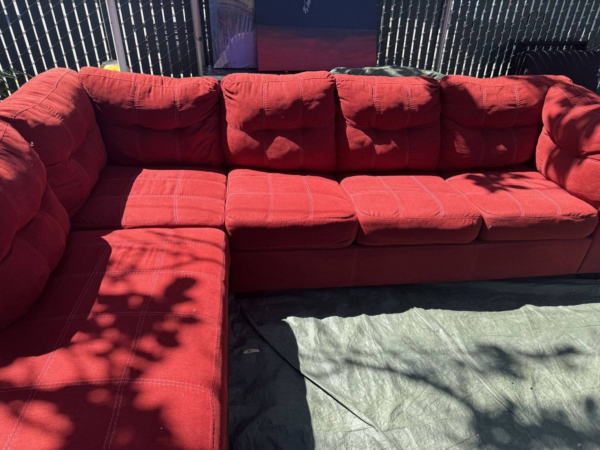 Red couch with pullout bed good condition clean we sell all the time delivery $40 local