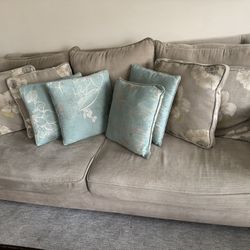 Beige Sofa couch with Pillows