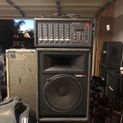 Sunn by Fender six channel power mixer with nine band EQ and 215 inch matching sun cabinets