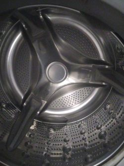 LG washer and dryer set with storage shelves