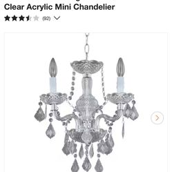 Hampton BayMaria Theresa 3-Light Chrome and Clear Acrylic Mini Chandelier New!!!  Got this from storage and I was told never opened or used it is tape