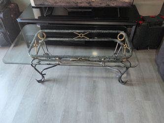 Iron glass coffee table / only needs the plastic round things to go inside for glass it's removable glass