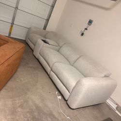 Recliner couch with console and drink holders.