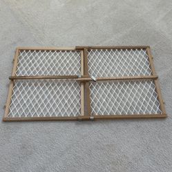 Expandable wooden baby gate for doorways.