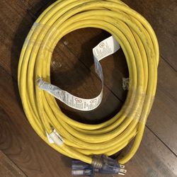 Heavy Duty 50' 12/3 SJTW Yellow Outdoor Extension Cord with Lighted End This professional-grade 12-gauge extension cord is built to withstand the rigo