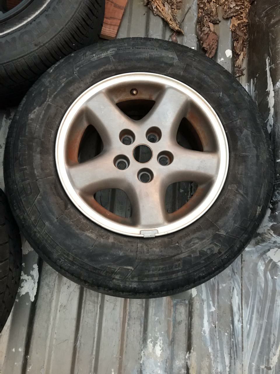 Tires go on a Jeep Cherokee comes with 5 rims with tires somewhere good some bad, and a good for f 150 red