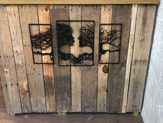 Wooden abstract faces wall art.