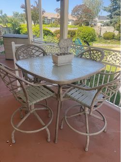 Glass top outdoor table and chair set