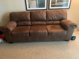 Brown leather seater couch looking for a good home