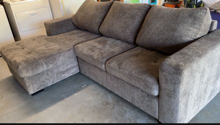 Nearly new L-shaped chenille three-person sleeper sofa