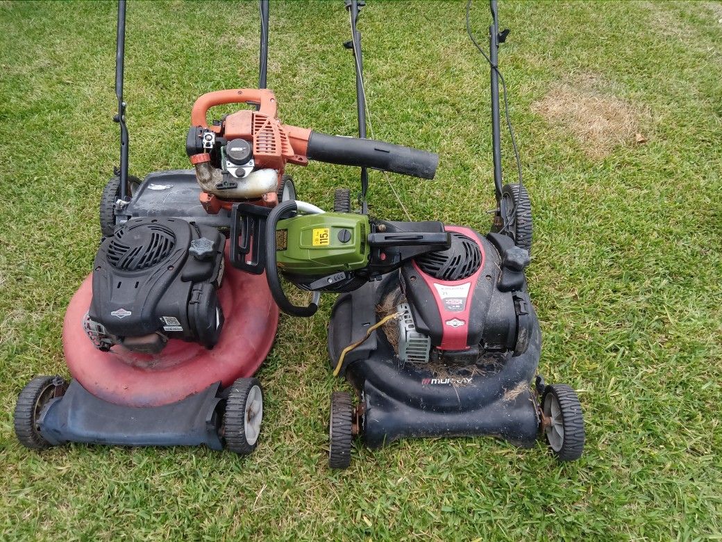 2 Lawn Mowers A Blower And Chain Saw
