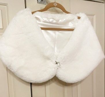 New, Firm, White Faux Fur Shawls (Wrap) with a silvertone bow and a genuine topaz dangle broach, Lg.