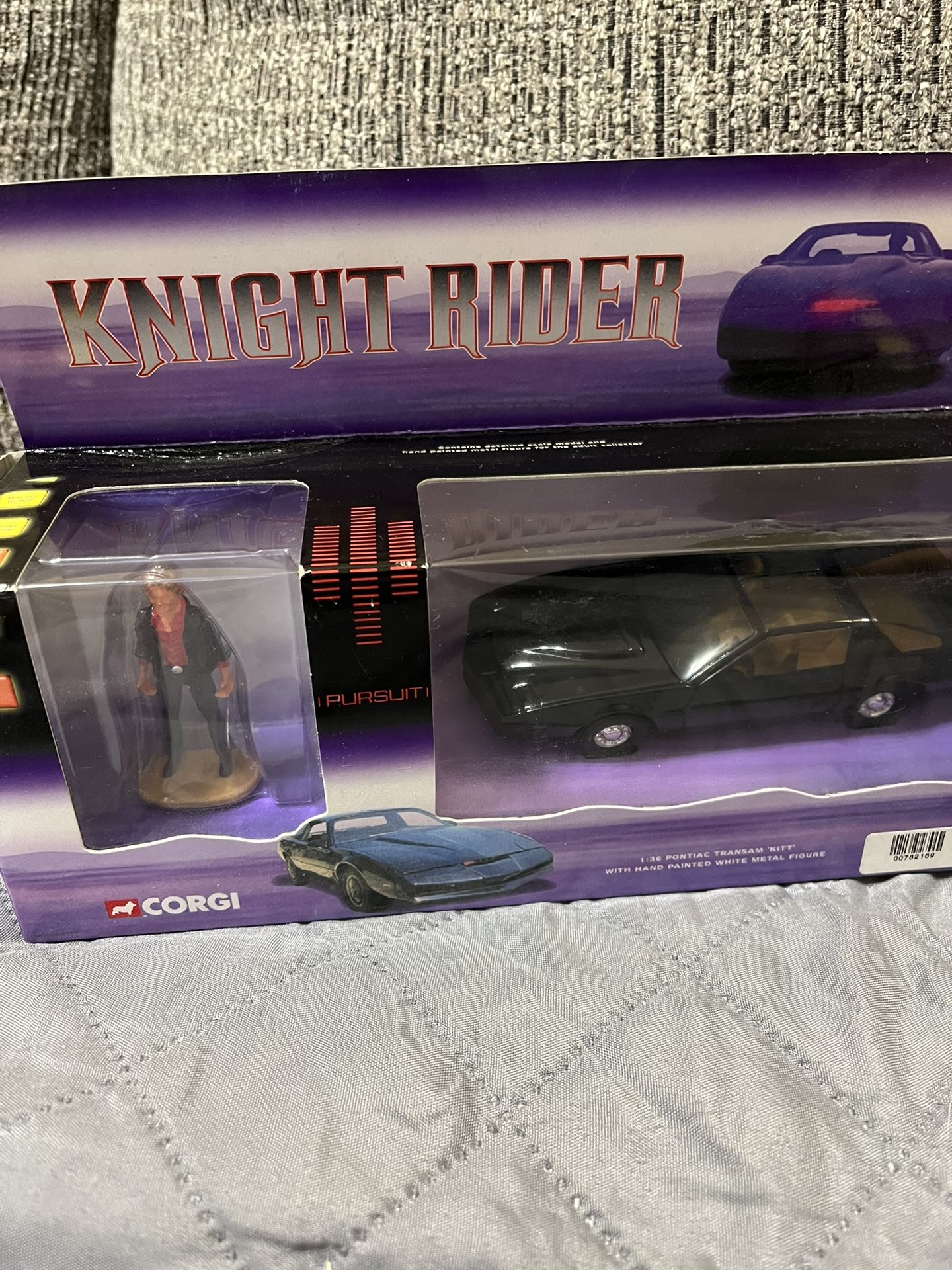 a Corgi die-cast model of KITT (Knight Industries Two Thousand) from the television series Knight Rider, accompanied by a Michael Knight figurine.