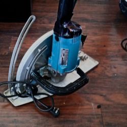 Makita original cutting machine 12" in cut various material like cement/asbestos/brick's tile / rock's in excellent condition 