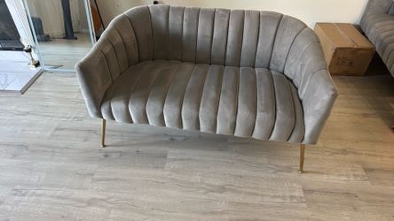 Grey velvet channel tuffed love seat
