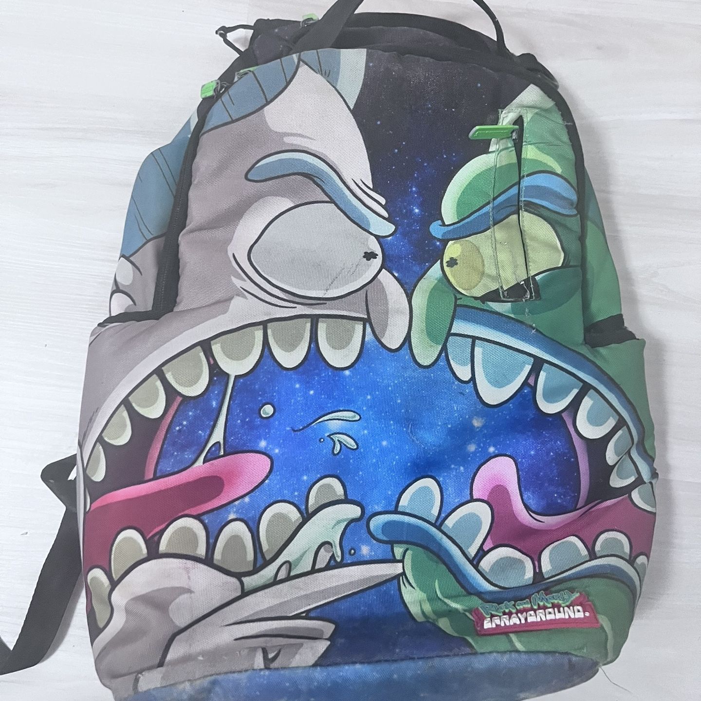 sprayground backpack rick and morty