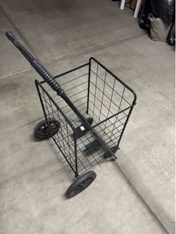 collapsible wire utility cart designed for transporting groceries, laundry, or personal items.