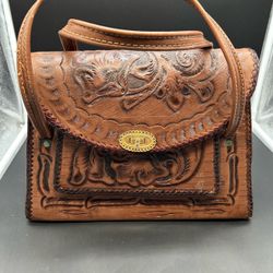 Vintage Tooled Leather Handbag pre owned. One chip