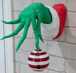 3D-printed Grinch Hand Wall Mount